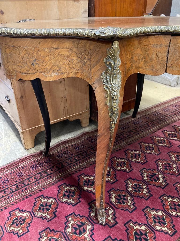 A 19th century French marquetry and kingwood centre table, (having later walnut-veneered top) width 124cm, depth 78cm, height 74cm